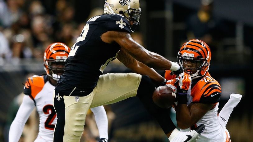 NEW ORLEANS, LA - NOVEMBER 16: Dre Kirkpatrick #27 of the Cincinnati Bengals nearly picks off a pass intended for Marques Colston #12 of the New Orleans Saints during the second half at Mercedes-Benz Superdome on November 16, 2014 in New Orleans, Louisiana. (Photo by Kevin C. Cox/Getty Images)