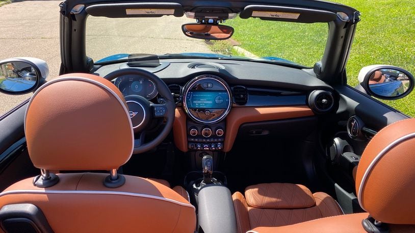 The Mini Cooper's interior is quite handsome. The leather seats have significant stitching and a light accent trim runs the exterior of the seats, including the rounded headrests. Contributed photo by Jimmy Dinsmore