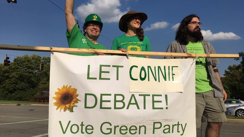 Constance Gadell-Newton, the Green Party candidate for governor, and her supporters protest that they are not allowed to take part in the Ohio governor’s candidate debate. STAFF/CHRIS STEWART