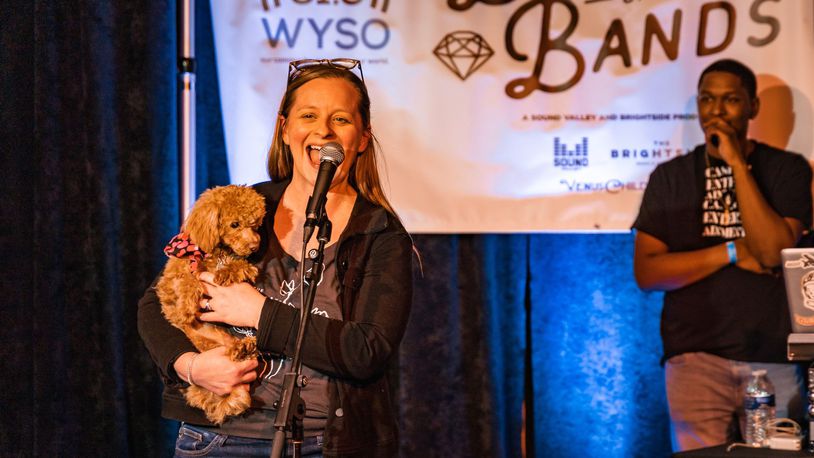 Libby Ballengee holds Misty on stage at The Brightside during Dayton Battle of the Bands. CONTRIBUTED PHOTOS