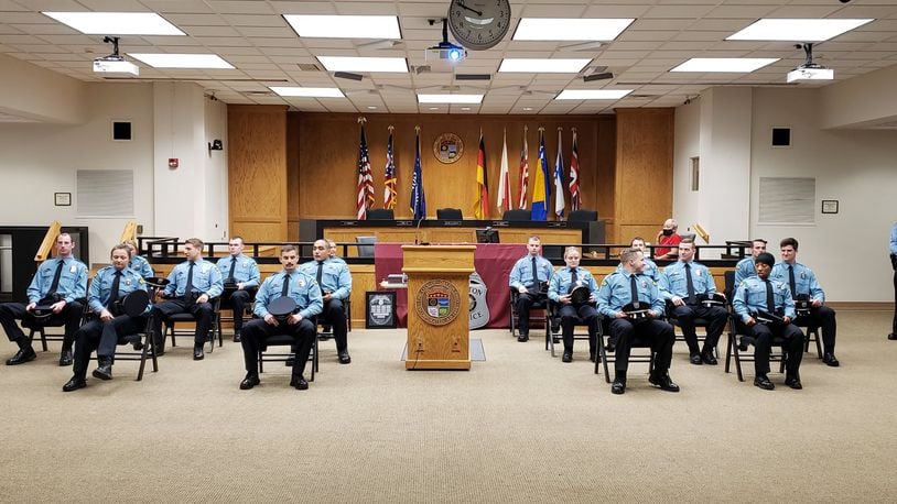 A photo posted to the Dayton Police Department's Twitter account, is captioned, "Getting ready to graduate! The 16 members of the 110th #DaytonPolice Recruit Class will be sworn in as officers this morning.  Congrats to all!"