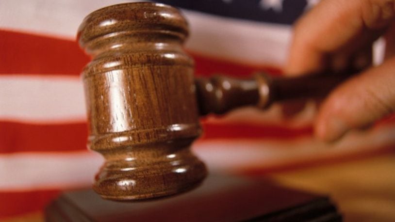 Two former officials of a local government contractor have been charged with conspiracy to defraud the United States government using a program meant to benefit service-disabled veterans.