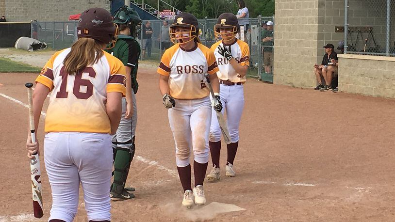 Haley Grau (16) of Ross prepares to congratulate Emily Poling (2) and Maddy Foster (3) after they scored runs in the fifth inning of Tuesday’s Division II district semifinal against Badin at Kings. RICK CASSANO/STAFF