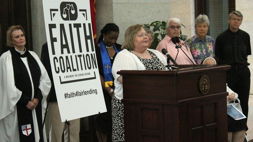 Springfield resident, Denise Cook Brooks tells her story dealing with payday lenders at an event at the Ohio Statehouse in June. JEFF GUERINI/STAFF