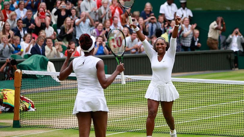 LONDON, ENGLAND - JULY 09: Venus Williams of The United States and Serena Williams of The United States celebrate victory in the Ladies Doubles Final against Timea Babos of Hungary and Yaroslava Shvedova of Kazakhstan on day twelve of the Wimbledon Lawn Tennis Championships at the All England Lawn Tennis and Croquet Club on July 9, 2016 in London, England. (Photo by Adam Pretty/Getty Images)