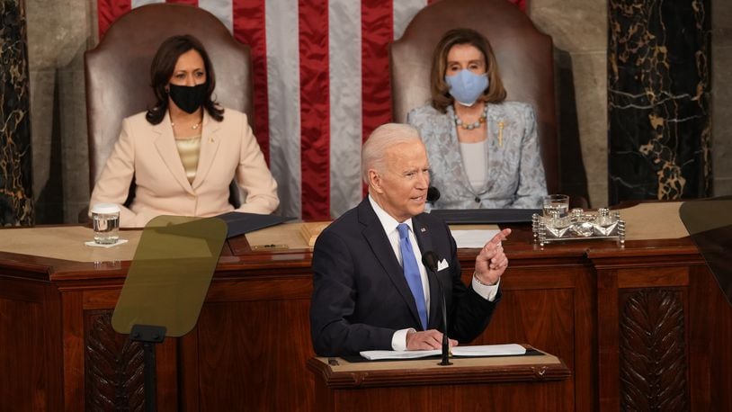 President Joe Biden addresses a joint session of Congress at the Capitol in Washington on Wednesday, April 28, 2021, as Vice President Kamala Harris, left, and Speaker of the House Nancy Pelosi (D-Calif.) look on. (Doug Mills/The New York Times)