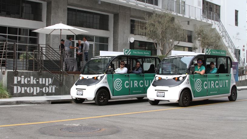 Circuit is an electric "micro-transit solution" that offers shuttle service in more than 40 markets and eight states.  A local entrepreneur says he plans to launch a new golf cart ride service in downtown Dayton using vehicles like those pictured. CONTRIBUTED