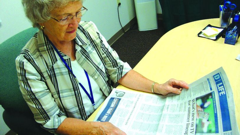 A volunteer for Goodwill Easter Seals Miami Valley reads the Dayton Daily News as part of a service for sight-impaired residents or those who cannot turn a page. Brinkman's readings and those of other reading volunteers are broadcast over special radios 24 hours a day. CONTRIBUTED
