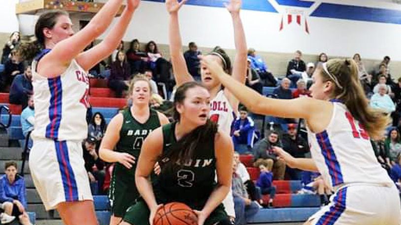 Badin’s Shelby Nusbaum (2) is surrounded by Carroll’s Julia Keller (42) and Jillian Roberts (13) during the Patriots’ 64-57 win. Carroll is No. 1 in Division II in the debut of the girls basketball state polls and Badin No. 9 in D-II. CONTRIBUTED PHOTO BY TERRI ADAMS