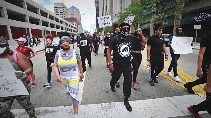 A protest event that began at the federal building in downtown Dayton on Saturday, May 30, 2020, moved to the area of Jones Street and Wayne Avenue, where police stopped marchers from entering U.S. 35 by using pepper spray balls and a line of officers. MARSHALL GORBY / STAFF