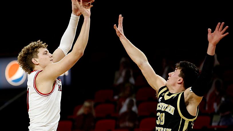 Miami Redhawks forward Javin Etzler hits a three pointer over Western Michigan guard Jason Whitens during Mid-American Conference play at Millett Hall in Oxford Jan. 30, 2021. Contributed photo by E.L. Hubbard