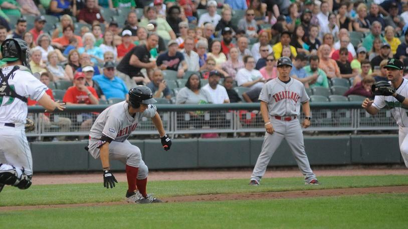 Dragons catcher Cassidy Brown (left) and third baseman John Sansone catch Mitchell Hansen in a rundown. The Dragons lost 8-3 to the visiting Great Lakes Loons (Dodgers) at Dayton’s Fifth Third Field on Thursday, June 15, 2017. MARC PENDLETON / STAFF