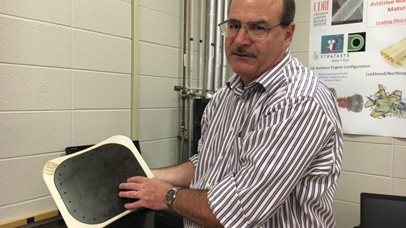 Brian Rice, a materials research engineer at the University of Dayton Research Institute, talks about the additive manufacturing research he and others are performing for the Air Force in a photo taken last year. THOMAS GNAU/STAFF