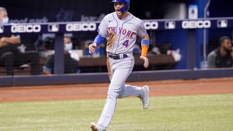 New York Mets' Albert Almora Jr. runs home to score on a single hit by Jonathan Villar during the sixth inning of a baseball game against the Miami Marlins, Thursday, Aug. 5, 2021, in Miami. (AP Photo/Lynne Sladky)