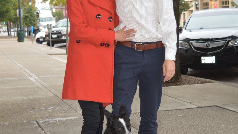 Chantel Raghu and Chris Reagh met in veterinary school and married before moving to Oxford last year where he joined his father’s veterinary practice and she commutes to her job at a vet clinic in Blue Ash. They are pictured on High Street with their rescue dog, Kai, a collie mix. CONTRIBUTED/BOB RATTERMAN