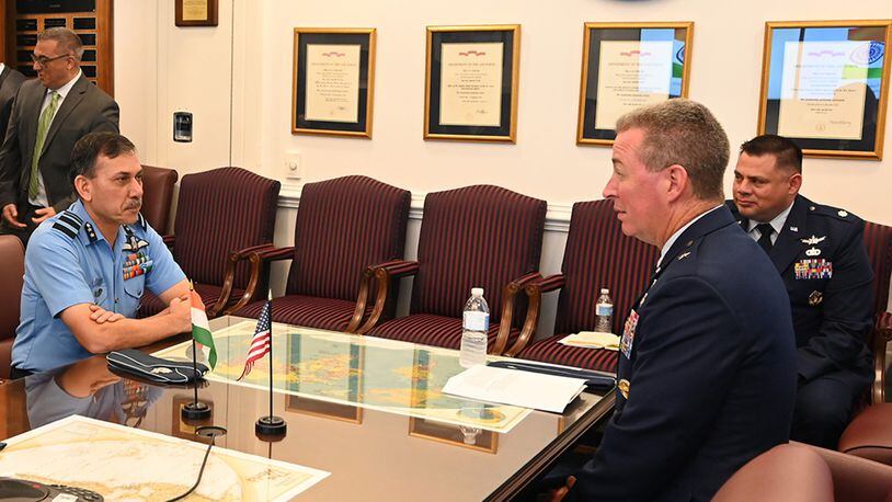 Brig. Gen. Brian Bruckbauer hosts an office call in honor of his fellow co-chair of the U.S.-India Defense Technology and Trade Initiative Air Vice Marshal Narmdeshwar Tiwari in the Pentagon, Arlington, Va., July 16. U.S. AIR FORCE PHOTO/ANDY MORATAYA