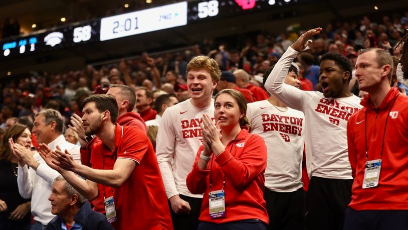 Dayton walks-ons and student managers celebrate behind the bench during the team's comeback in the second half against Nevada in the first round of the NCAA tournament on Thursday, March 21, 2024, at the Delta Center in Salt Lake City, Utah. David Jablonski/Staff