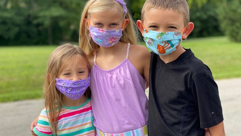 Stella, Savannah and Owen Bettag are getting ready to go back to school by wearing their masks whenever they go out in public. The children attend Wayne Local Schools in Waynesville where Savannah will be a third grader, Owen, a second grader and Stella, a preschooler. CONTRIBUTED