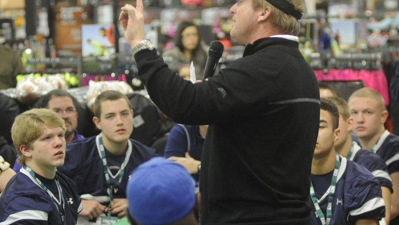 ESPN Monday Night Football analyst Jon Gruden makes a point. Gruden presented donation checks and equipment generated by DICK’S Sporting Goods and the DICK’S Sporting Goods Foundation “Sports Matter” to 10 area high school football programs at Dick’s at The Mall at Fairfield Commons in 2014. MARC PENDLETON / STAFF