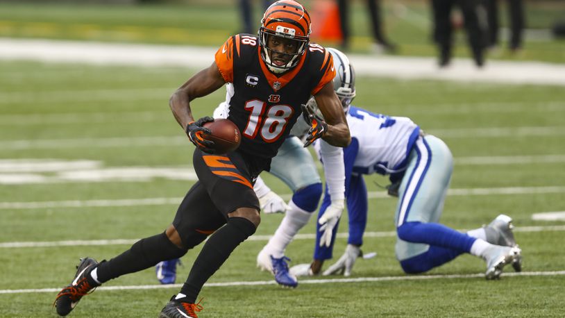 Cincinnati Bengals wide receiver A.J. Green (18) runs after a catch against the Dallas Cowboys in the first half of an NFL football game in Cincinnati, Sunday, Dec. 13, 2020. (AP Photo/Aaron Doster)