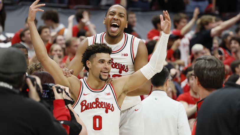 Ohio State's Tanner Holden, front, celebrates his game-winning basket against Rutgers with Zed Key during an NCAA college basketball game on Thursday, Dec. 8, 2022, in Columbus, Ohio. (AP Photo/Jay LaPrete)