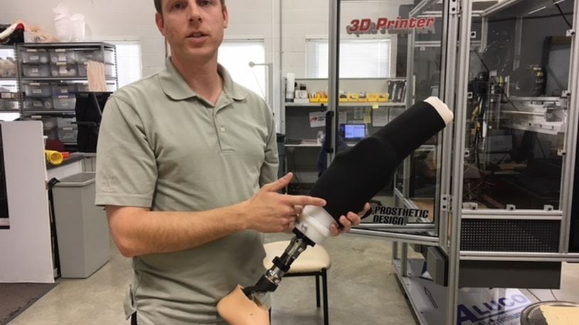 Brad Poziembo, a prosthetist for Dayton Artificial Limb, talks about harnessing 3-D printing in his business and industry. THOMAS GNAU/STAFF