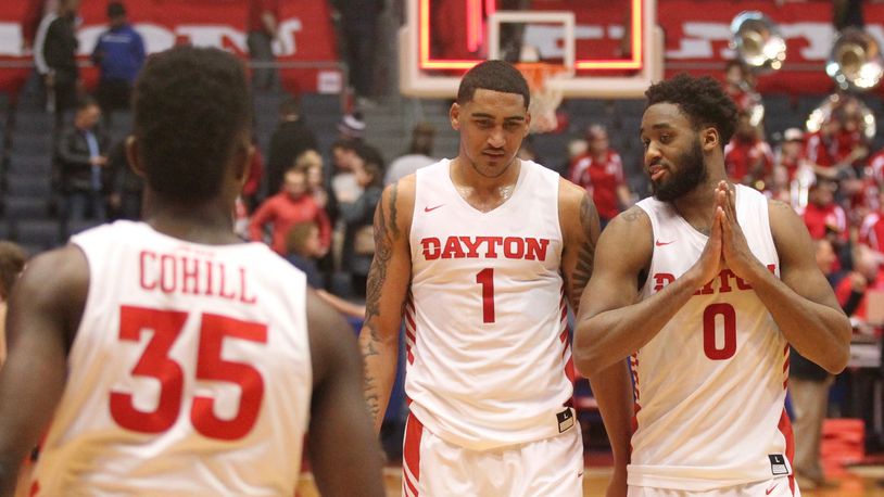 Dayton’s Obi Toppin and Josh Cunningham talk as they leave the court after a victory against Richmond on Jan. 6, 2019, at UD Arena. David Jablonski/Staff
