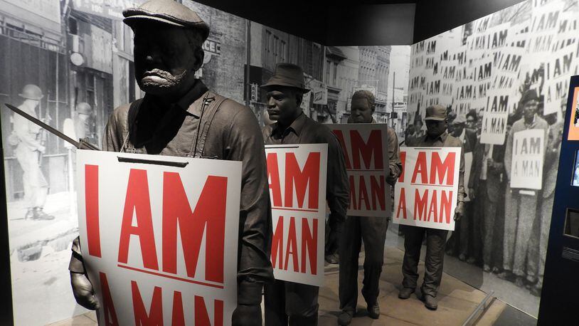 In a museum exhibit detailing the 1968 strike by Memphis garbagemen, models of the sanitation workers hold placards that read “I Am a Man,” the battle cry of their successful effort to organize a union. (Jay Jones/Chicago Tribune/TNS)
