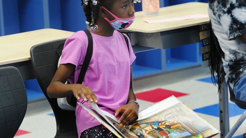 Kykarah Williams reads out loud during DPS Summer Camp at Fairview Elementary in summer 2022. Fairview is one of the schools in northwest Dayton which offered incentives for student attendance last year. MARSHALL GORBY\STAFF
