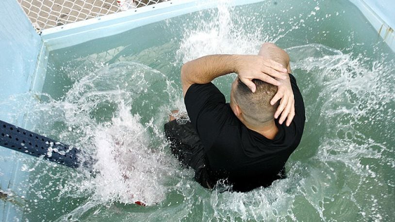 In this Springfield News-Sun file photo from 2008, a Clark County sheriff's deputy takes a plunged in a dunk tank. Staff File Photo by Barbara J. Perenic