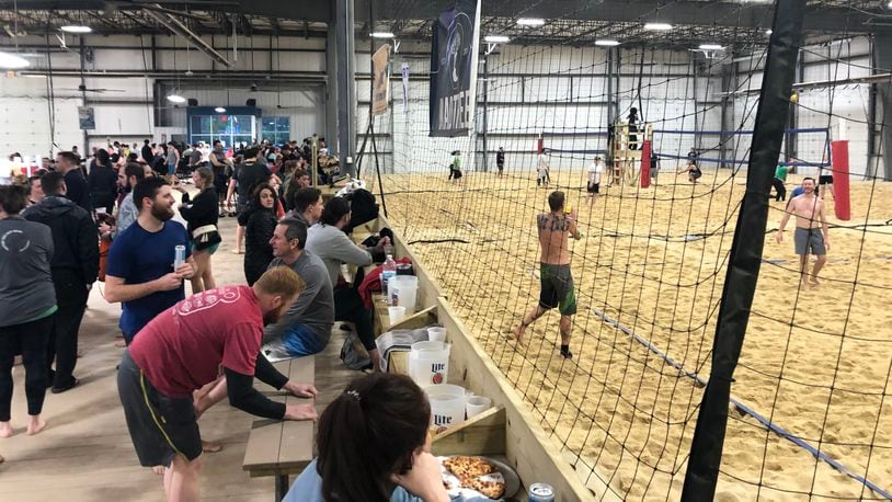 Hundreds of people eat, drink and play volleyball at the Miami Valley Sand complex in West Carrollton, built on the former site of a Fraser Paper mill. JEREMY P. KELLEY / STAFF
