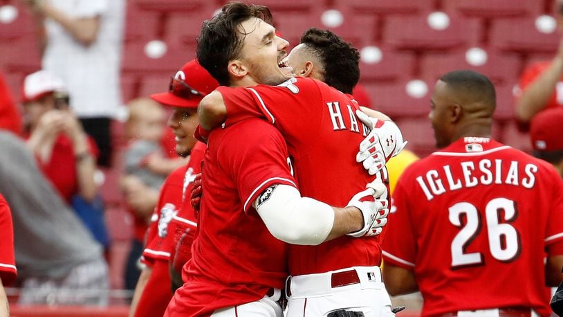 CINCINNATI, OH - MAY 09: Adam Duvall #23 of the Cincinnati Reds hugs Billy Hamilton #6 after hitting a walk off home run in the 10th inning for a 2-1 win over the New York Mets at Great American Ball Park on May 9, 2018 in Cincinnati, Ohio. (Photo by Andy Lyons/Getty Images)