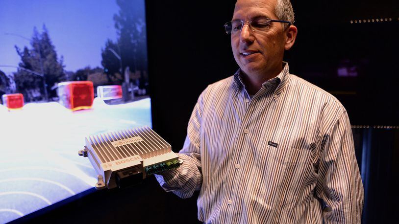 How Nvidia’s ‘brains’ are dominating the self-driving race: Danny Shapiro, senior director, holds the company’s Nvidia Drive PX2 processor at Nvidia in Santa Clara, Calif., on May 3, 2017. Known for making processors for video games, Nvidia makes the ‘brains’ behind most self-driving cars on the road today, transforming itself into a leader in the self-driving car industry. (Dan Honda/Bay Area News Group/TNS)