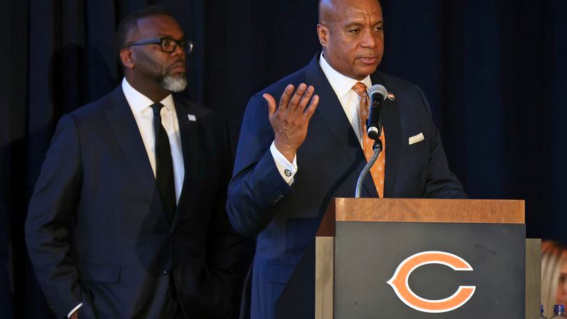 Chicago Mayor Brandon Johnson, right, joined by Chicago Bears president Kevin Warren, speaks during a news conference where NFL football team unveiled a nearly $5 billion proposal Wednesday, April 24, 2024, in Chicago, for an enclosed stadium next door to their current home at Soldier Field.(AP Photo/Teresa Crawford)