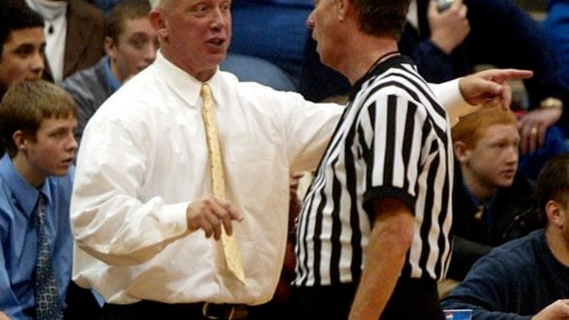 Fairmont head coach Hank Bias discusses a call with a referee after technical fouls were called on both teams late in the second period of game at West Carrollton Friday, Jan. 2. Fairmont came out on top in overtime 68 to 67.