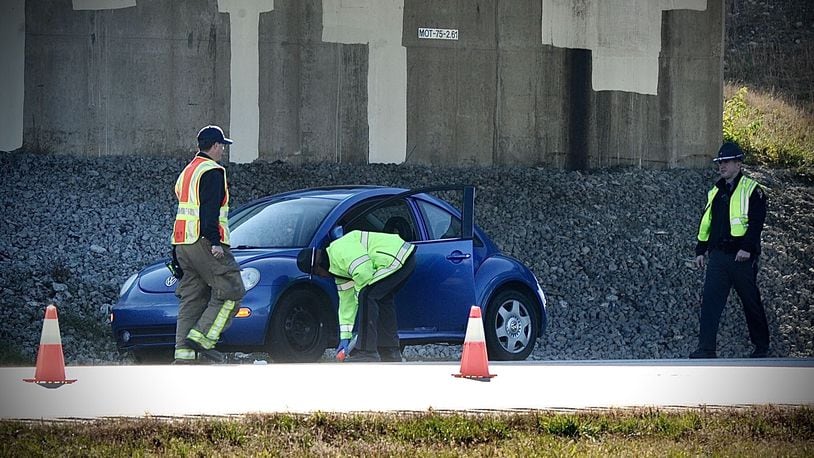 Miami Twp. police and Ohio State Highway Patrol troopers work at a crash scene Nov. 8, 2021, on northbound Interstate 75 in Miami Twp. Township trustees are working to determine the size and millage amount for a police levy to replace one that is about to expire. MARSHALL GORBY/STAFF