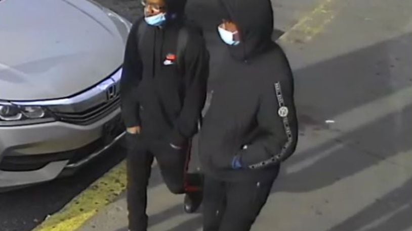 Police are asking for help identifying the two people in this photo