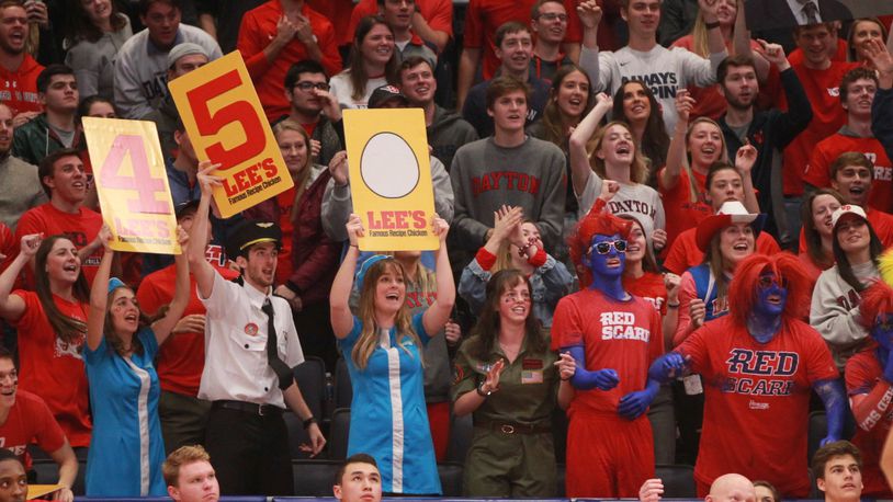 Fans in the Red Scare section cheer during a game against Omaha on Tuesday, Nov. 19, 2019, at UD Arena. Among the students is Emily Noll, who's in the center wearing the flight attendant uniform.