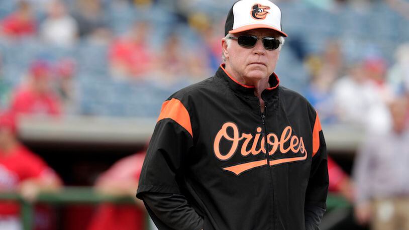 Baltimore Orioles manager Buck Showalter stands on the field before a baseball spring exhibition game against the Philadelphia Phillies, Saturday, Feb. 24, 2018, in Clearwater, Fla. (AP Photo/Lynne Sladky)