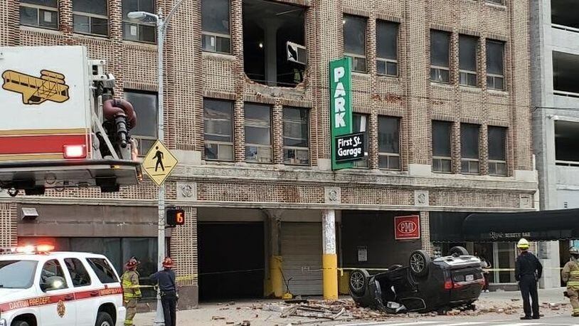 A 53-year-old woman is in stable condition after an SUV she was inside crashed and fell from the second floor of a Dayton parking garage on West First Street Thursday morning. CONTRIBUTED