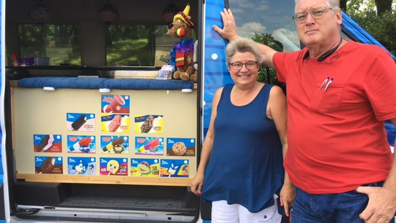 Shelly and James “Jimbo” Greenberg sell ice cream from a fleet of vans — and business has been good, the Greenbergs say. On a recent afternoon, they were in the neighborhood around Steam Academy of Dayton. THOMAS GNAU/STAFF