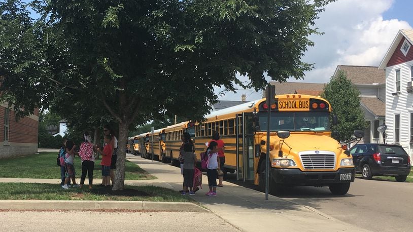 Dayton Public Schools had a driver shortage last year. The district spread out its school start times, so they could cover the same schools with fewer drivers. JEREMY P. KELLEY / STAFF