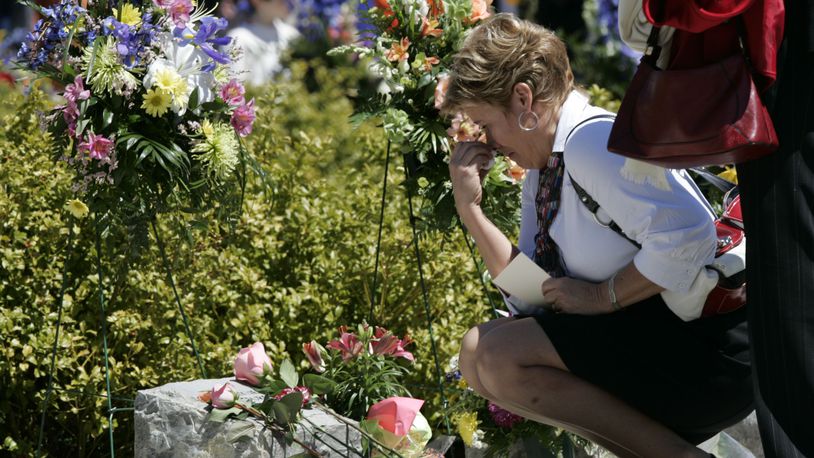 One of the deadliest campus shootings in American history took place at Virginia Tech in 2007. Here, in this archive photo, an unidentified family member wipes her face as she placed a flower on a memorial marker during ceremonies marking the second anniversary of the April 16, 2007 shootings at Virginia Tech on the campus of the school in Blacksburg, Va., Thursday, April 16, 2009. (AP Photo/Steve Helber)