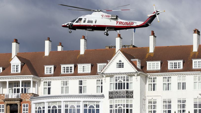 FILE - In this July 29, 2015 file photo, a helicopter owned by Donald Trump departs from the Turnberry golf course in Turnberry, Scotland. Feelings toward Trump run from anger to praise in Scotland where the troubles for the presidentâs two golf clubs have only mounted recently. A financial report filed with the British government shows Trump is losing millions for a third year in a row. (AP Photo/Scott Heppell, File)