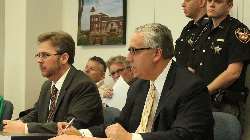 Champaign County Prosecutor, Kevin Talebi (right) and Assistant Prosecutor Benjamin Hoskinson listen to Juvenile Court Judge Lori Reisinger in a hearing involving murder charges against 14 year old Donovan Nicholas. JEFF GUERINI/STAFF