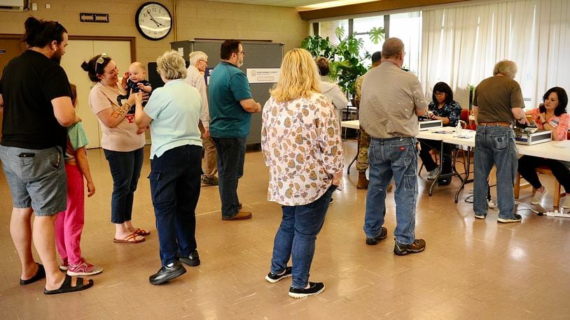 Voters wait in line to vote Tuesday, May 3, 2022 at the Dayton Korean Grace Church. MARSHALL GORBY \ STAFF