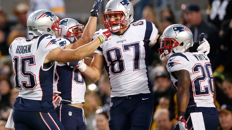 New England Patriots tight end Rob Gronkowski (87) celebrates his touchdown with teammates during the second half of an NFL football game against the Pittsburgh Steelers in Pittsburgh, Sunday, Oct. 23, 2016. (AP Photo/Jared Wickerham)