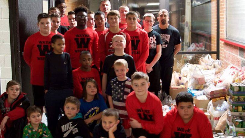 Huber Heights student athletes helped donate food for holiday meals. CONTRIBUTED