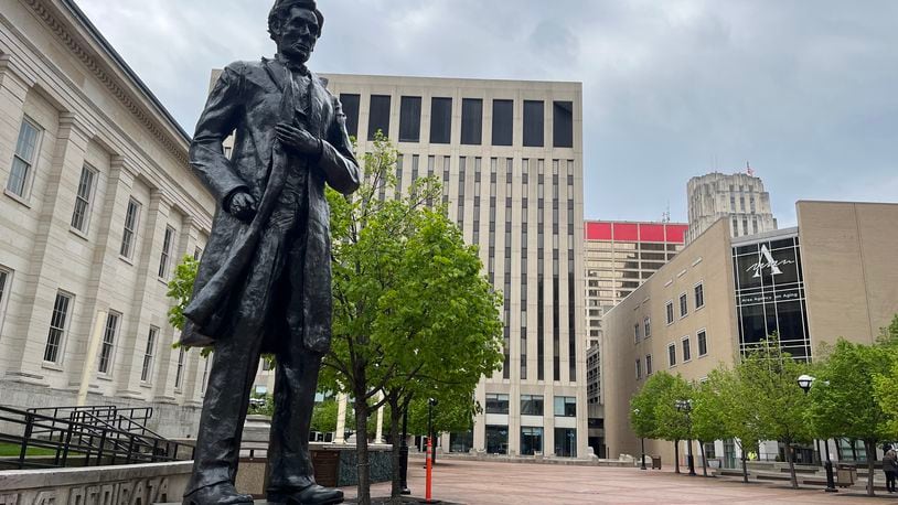 An 11-foot-tall statue of Abraham Lincoln greets visitors to downtown Dayton's Courthouse Square, commemorating his speech in Dayton on the steps of the Old Court House on Sept. 17, 1859. From Thursday to Sunday, there will multiple people dressed like Lincoln and others dressed in 19th-century attire around Montgomery County, as the Association of Lincoln Presenters (ALP) hosts its annual conference in Dayton. CORNELIUS FROLIK/STAFF