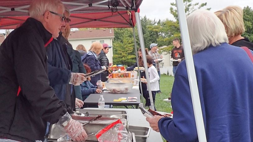 Members of Centerville’s Southminster Church conducted “The Church Has Left the Building” last week. Several members served A cookout lunch to residents of the Chevy Chase Apartments. CONTRIBUTED